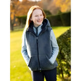 Gray fleece-lined lemieux young rider eloise reversible winter gilet with hood and front zipper over blue shirt