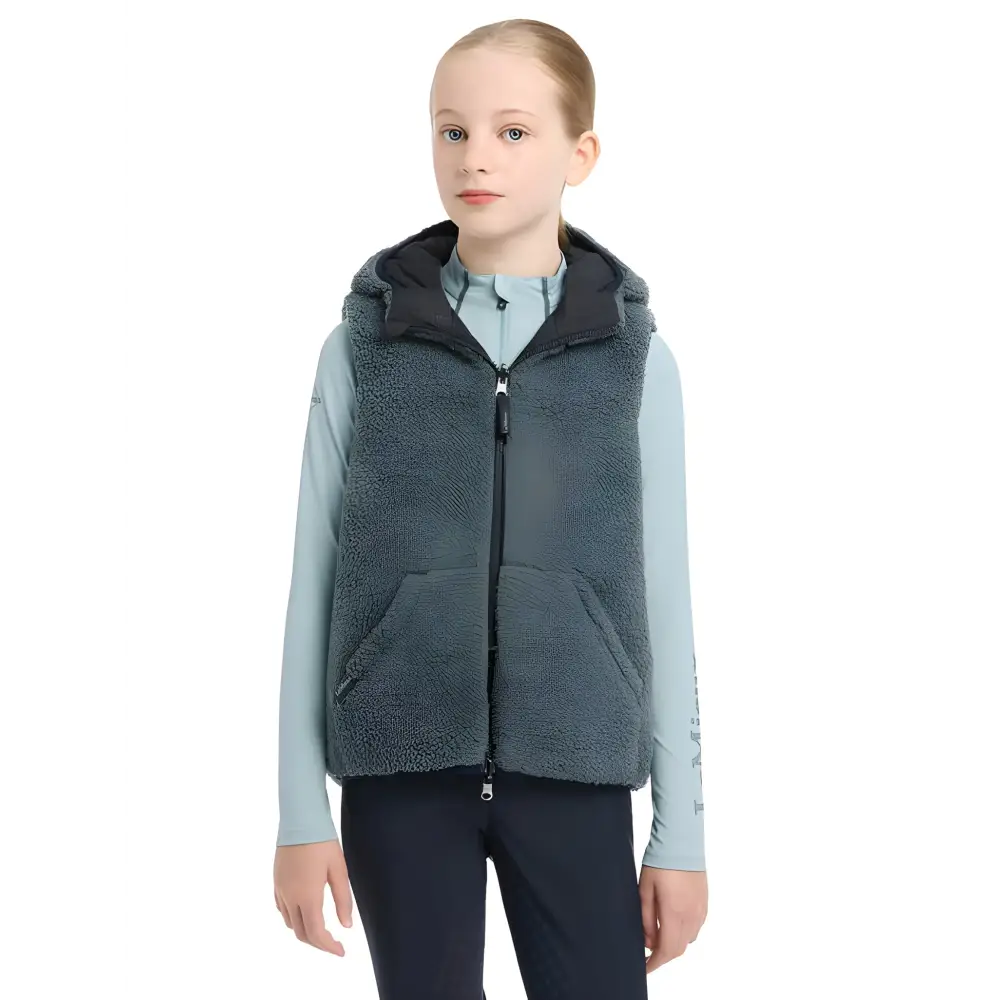 Gray hooded fleece vest over light blue shirt from Lemieux Young Rider Eloise collection