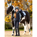 Horse with black and white coloring beside rider in Lemieux Young Rider Eloise Gilet