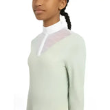 A lemieux young rider eva long sleeve show shirt pistachio with a pale green body, white collar, and sparkly mesh panel