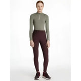 Olive green long-sleeved zip-neck top paired with lemieux young rider seat izzy breeches damson for riding comfort
