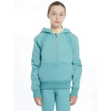 A teal lemieux young rider harriet pop half zip hoodie with a subtle logo on the front pocket in lagoon color