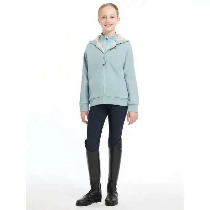 Light blue lemieux young rider hollie lined hoodie with cream fleece-lined hood and subtle stitching details
