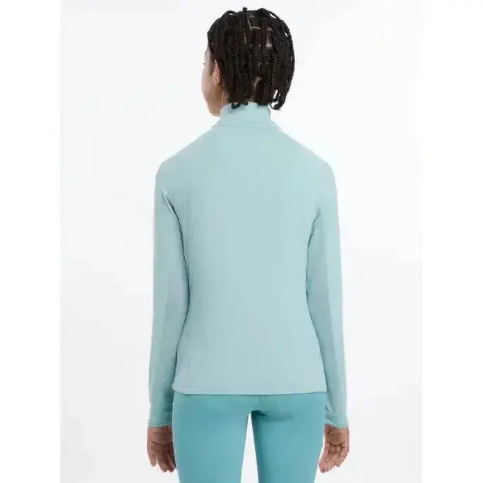 A light blue lemieux young rider hope lightweight base layer with long sleeves and high neck in smooth fabric