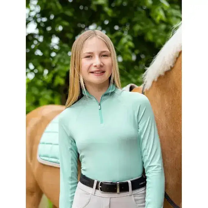 Mint green lemieux young rider hope lightweight base layer long sleeve top with quarter zip collar for riding