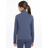 A navy blue lemieux young rider lightweight base layer jacket with long sleeves and a high collar for layering