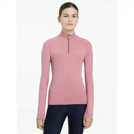 A soft pink lemieux young rider hope lightweight base layer peony with long sleeves and a quarter-zip collar