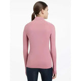 A soft pink lemieux young rider hope base layer peony with long sleeves high collar and seamless design
