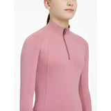 A soft pink lemieux young rider hope base layer peony with long sleeves high collar and zipper detail