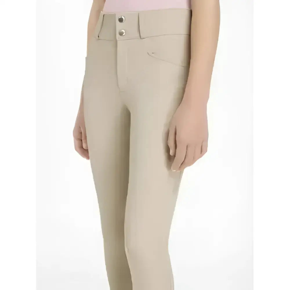 Beige lemieux young rider hunter breeches with high waist button closure and subtle stitching details
