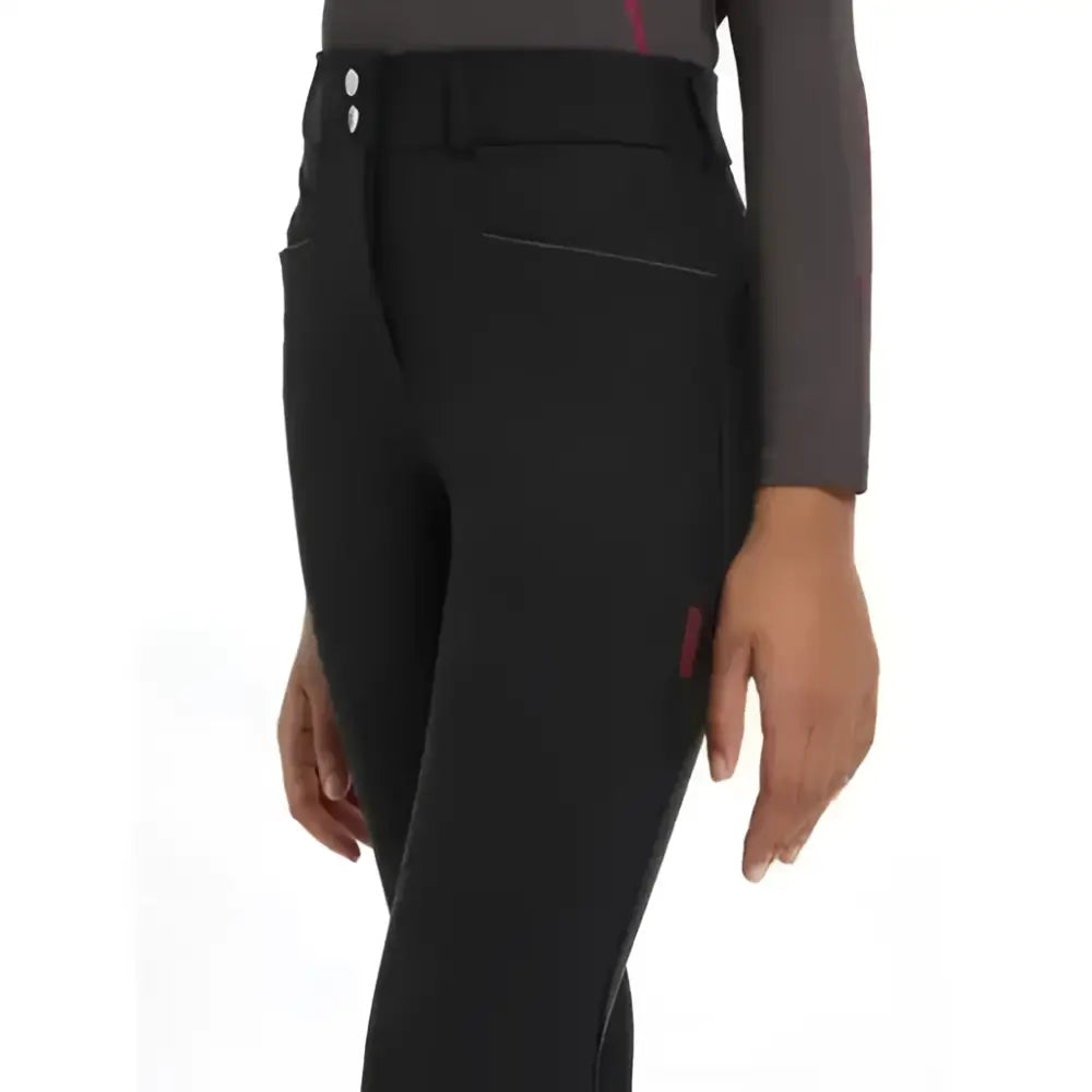 Black lemieux young rider izzy knee grip breeches with sleek form-fitting design and subtle red branding on the side