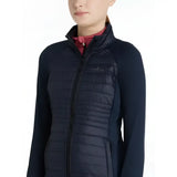 Dark navy quilted puffer lemieux young rider josephine jacket with high collar and zipper front for winter riding