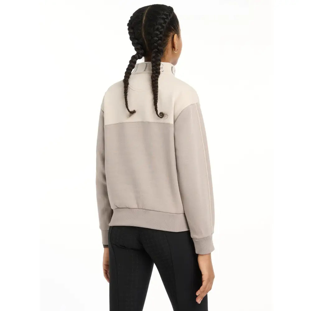 Two-tone Lemieux Young Rider Kate Quarter Zip sweatshirt worn by a person with braids