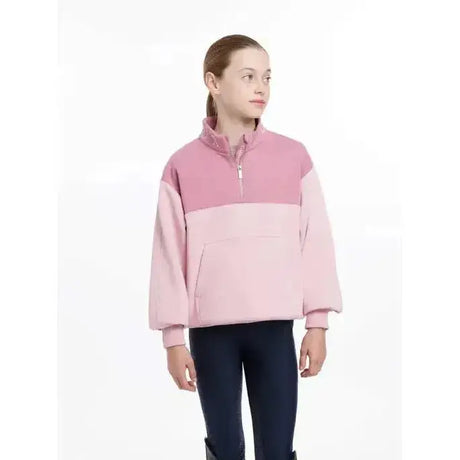 Pink two-tone fleece half zip sweatshirt with soft cozy texture and light pink sleeves lemieux young rider kate quarter zip zip sweat blossom