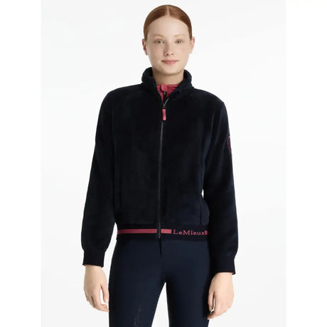 Black velvet zip-up jacket with pink zipper pull and lemieux belt detail from lemieux young rider libby fleece navy collection