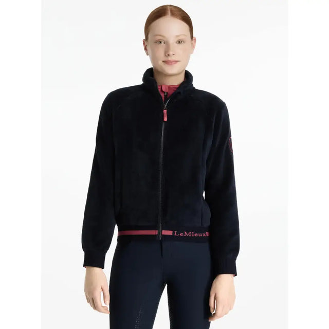 Black velvet zip-up jacket with pink zipper pull and lemieux belt detail from lemieux young rider libby fleece navy collection