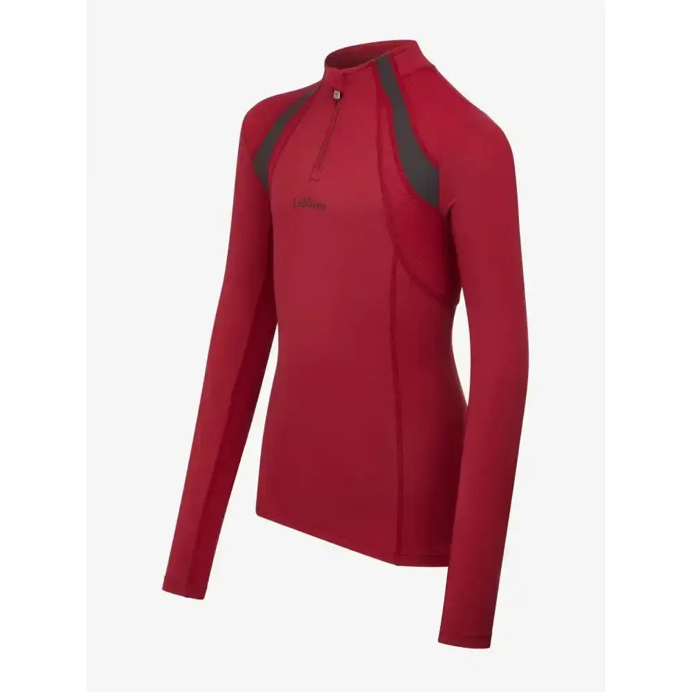 Red long-sleeved lemieux young rider mia mesh base layer with dark gray panels and quarter-zip collar ember color