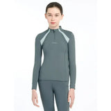 A sleek lemieux young rider mia mesh base layer long sleeve top in muted gray with light blue contrast panels