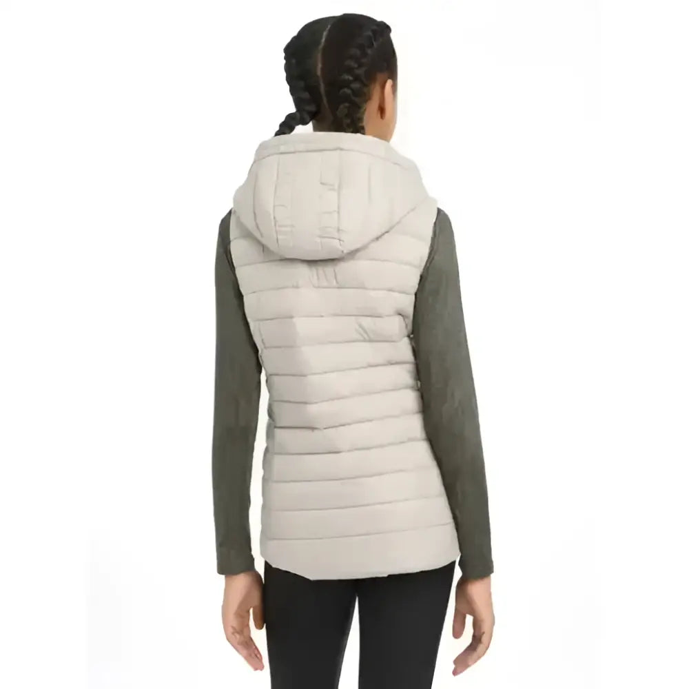 Beige quilted lemieux young rider milly puffer gilet with hood and dark green long sleeves for riding comfort