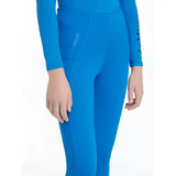 Bright blue form-fitting wetsuit pants with long sleeves and subtle logo on thigh lemieux young rider orla pull ons benetton blue