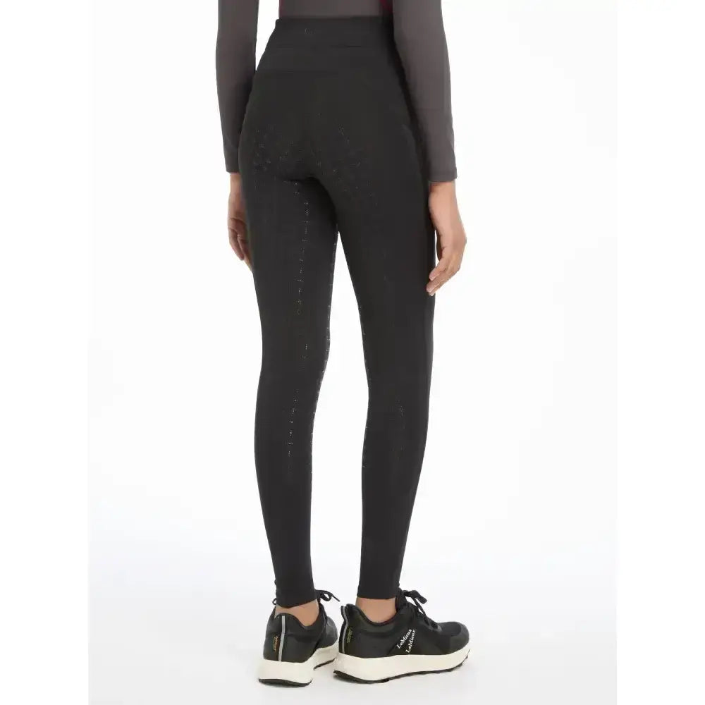 Black high-waisted lemieux young rider orla pull ons leggings with subtle side stitching details