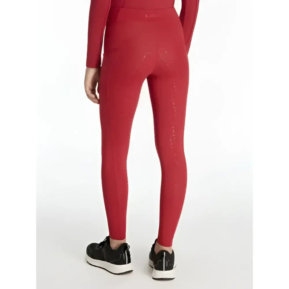 Red lemieux young rider orla pull ons with subtle textured detailing on outer thigh perfect for young riders