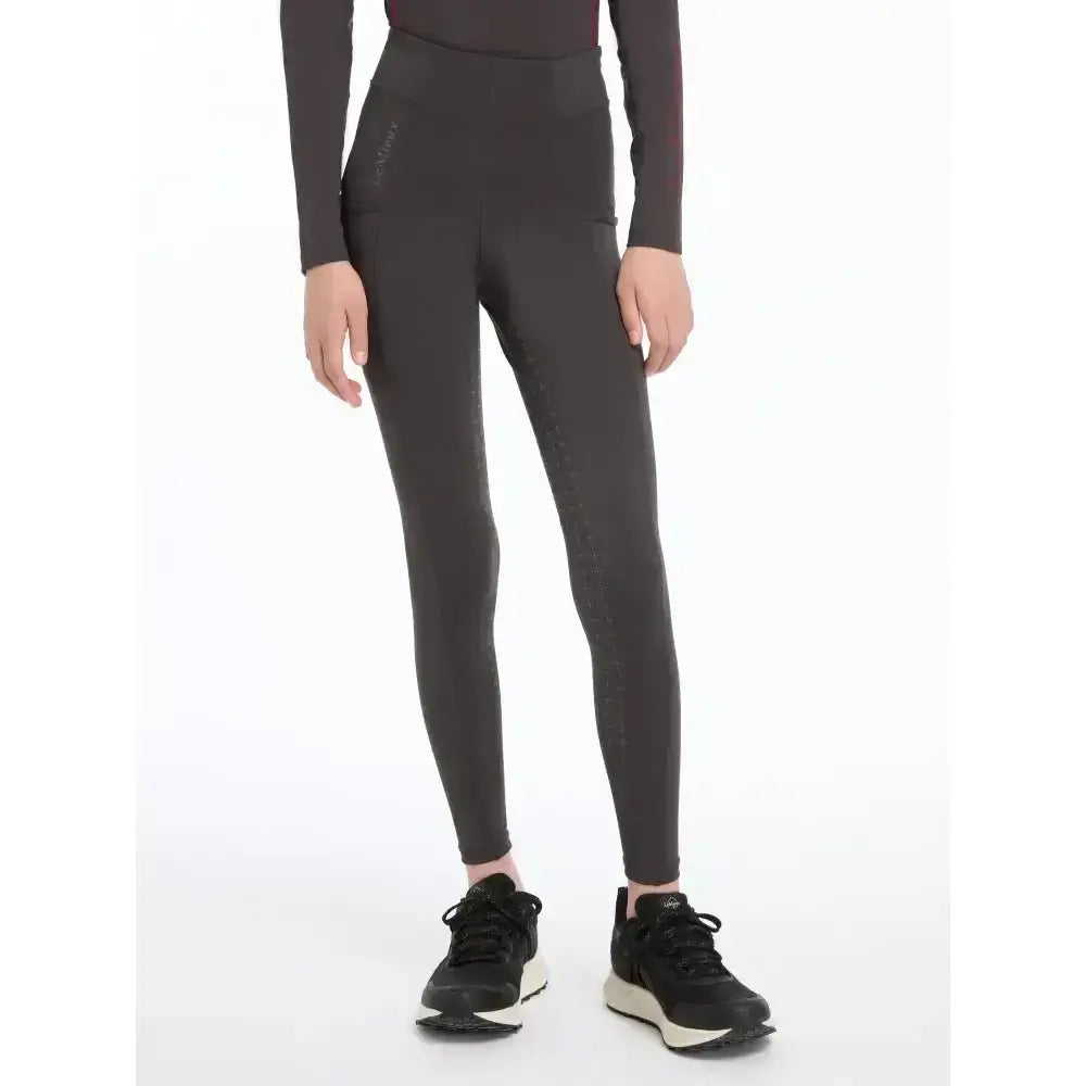 Black high-waisted lemieux young rider orla pull ons with sleek fit and subtle side seam detailing in cinder color