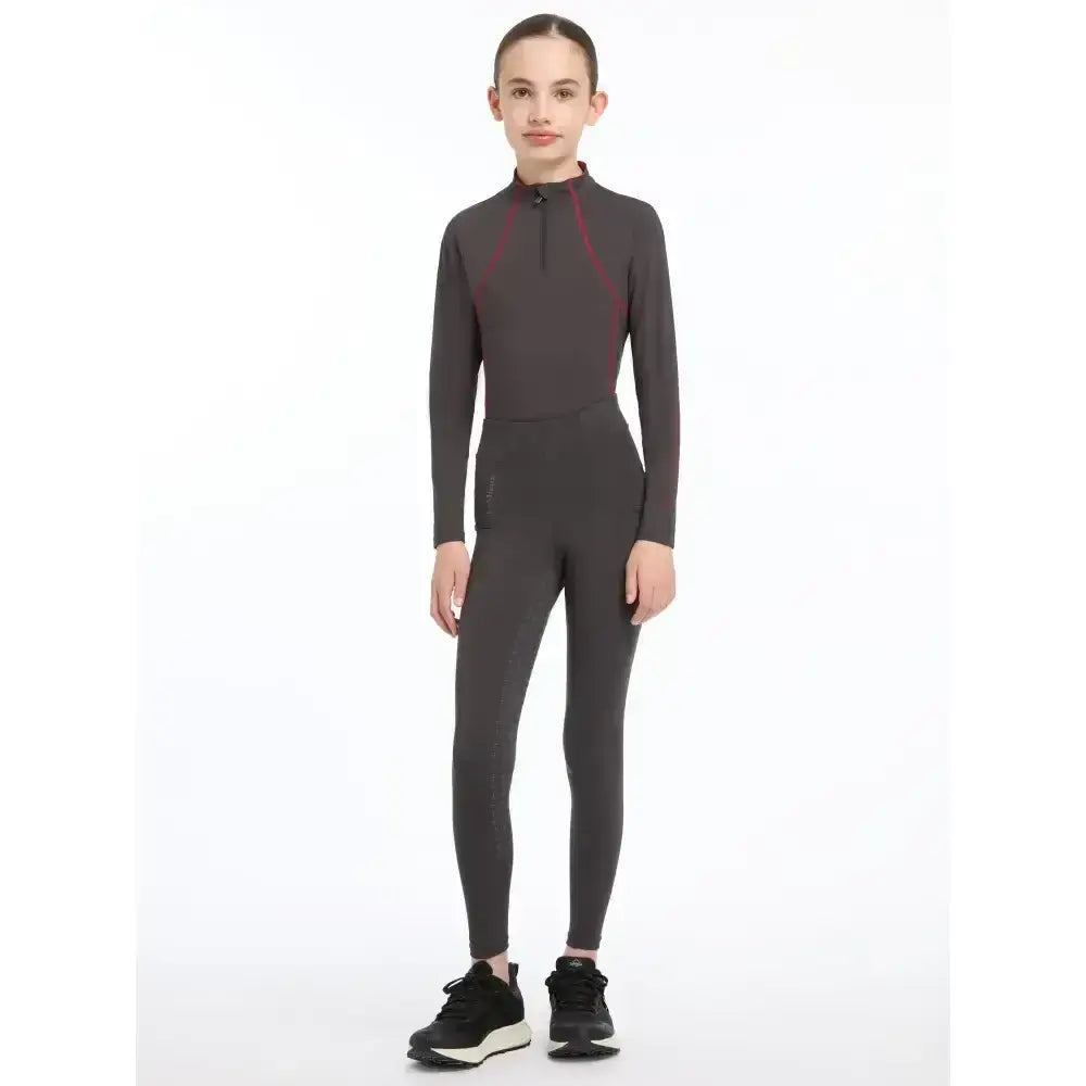 A sleek dark gray lemieux young rider orla pull ons bodysuit with maroon accents designed for young riders