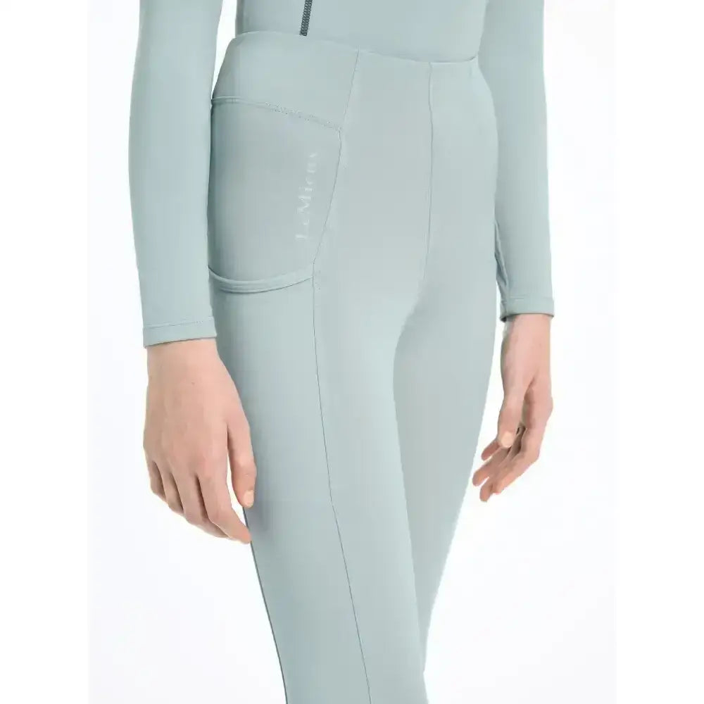 Light blue lemieux young rider orla pull ons one-piece athletic suit with long sleeves side zipper and front pocket