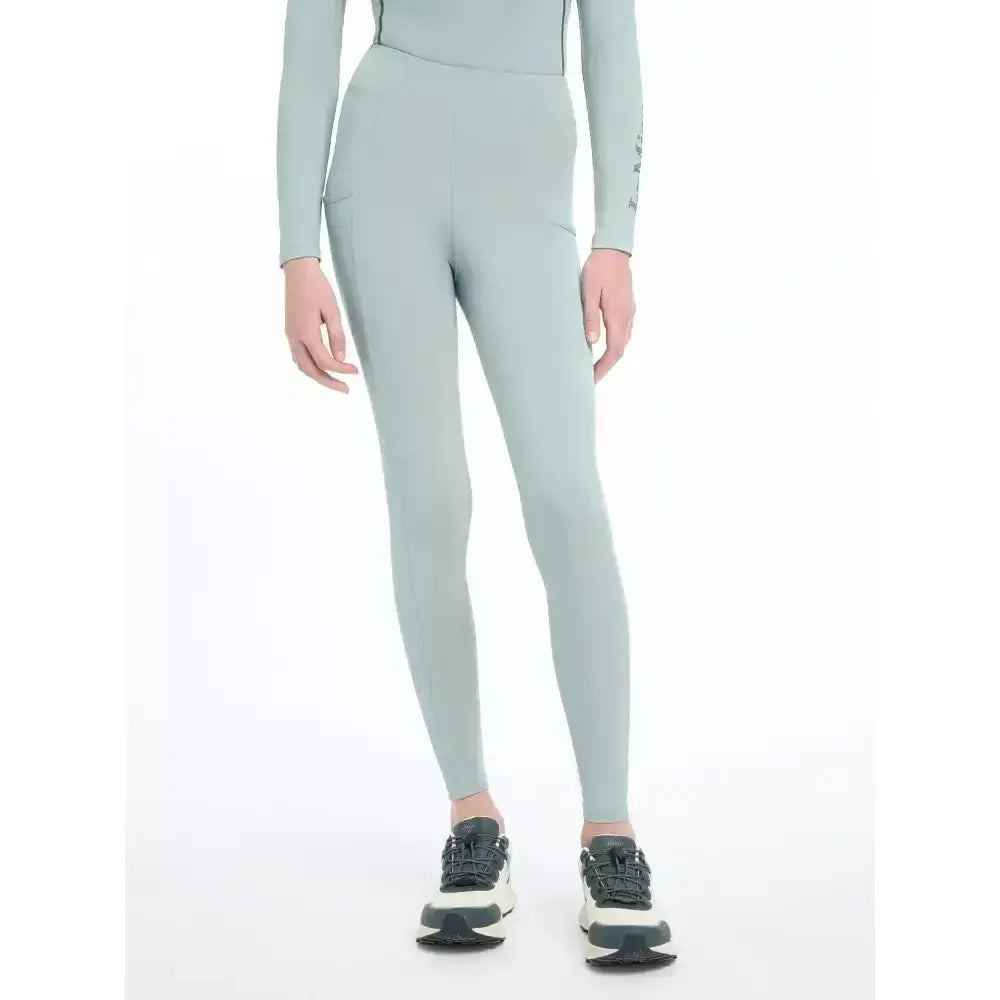 Light green high waisted lemieux young rider orla pull ons leggings with sleek form fitting design in glacier color