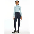 Light blue long-sleeve athletic top with black zipper paired with dark navy lemieux young rider orla pull ons leggings