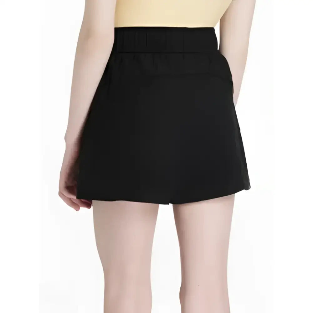 Black lemieux young rider penelope shorts with high waisted pleated waistband and flared hem for riding comfort