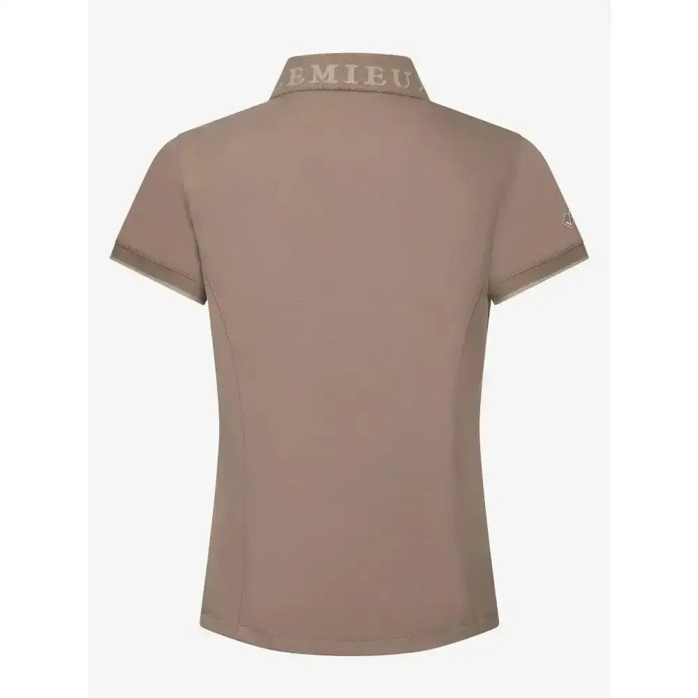 Beige lemieux young rider polo shirt in pique fabric with subtle emieu logo on collar and embroidered emblem on sleeve