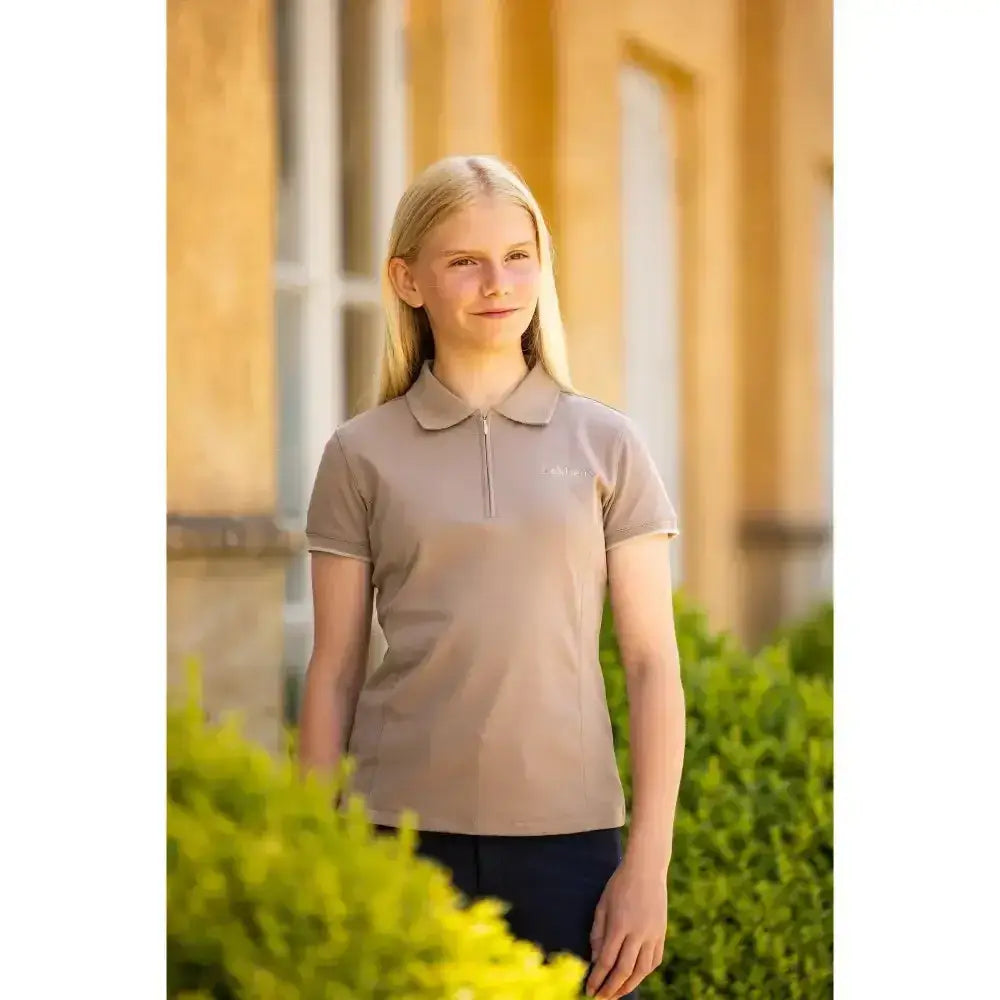 Beige lemieux young rider polo shirt with collar and zipper placket made from breathable pique fabric