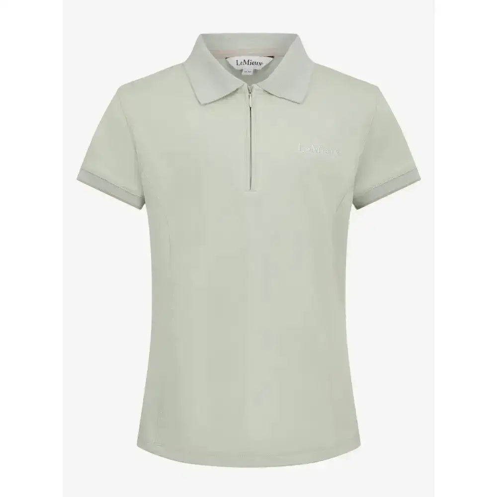 A light green lemieux young rider polo shirt pistachio with a chest logo and zipper collar perfect for young riders