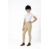 A child wearing beige lemieux young rider pull on breeches with sweat wicking and 4-way stretch fabric