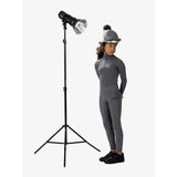 Gray equestrian helmet with black pom pom and silver trim paired with lemieux young rider breeches slate active