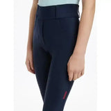 Navy blue lemieux young rider remi breggings with subtle pink logo on side seam perfect for young riders