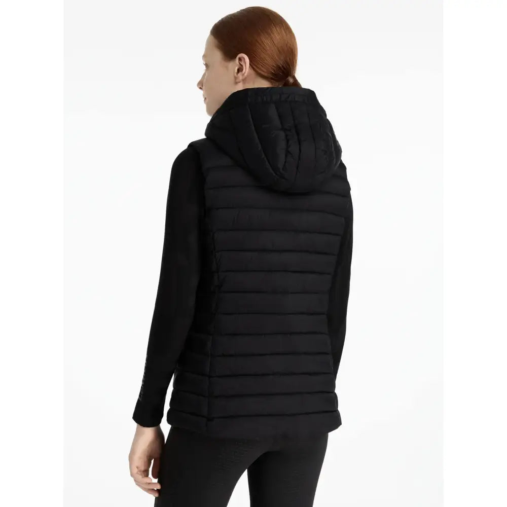 Black quilted hooded vest with long sleeves and sleek design from lemieux young rider ruby gilet black collection