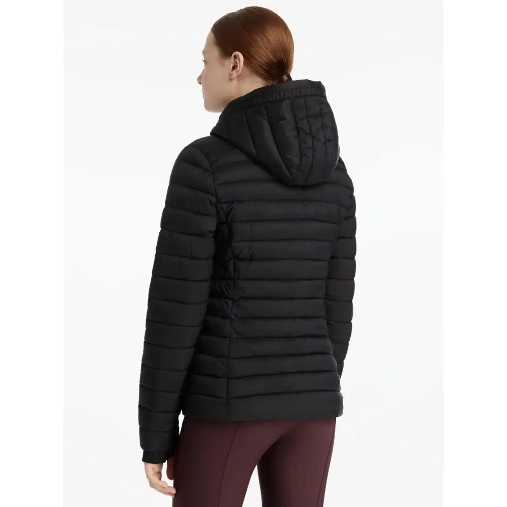 Black quilted puffer jacket with hood from lemieux young rider ruby puffer jacket for cold weather riding