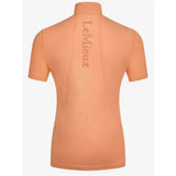 Back view of a peach lemieux young rider short sleeve base layer sherbet with vertical brand name embroidery