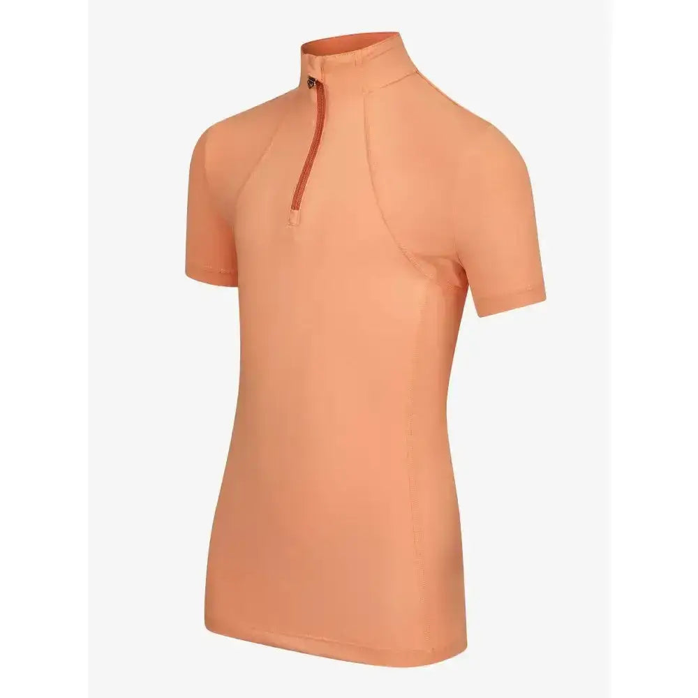 Peach-colored lemieux young rider short sleeve base layer sherbet with half-zip collar and subtle seams