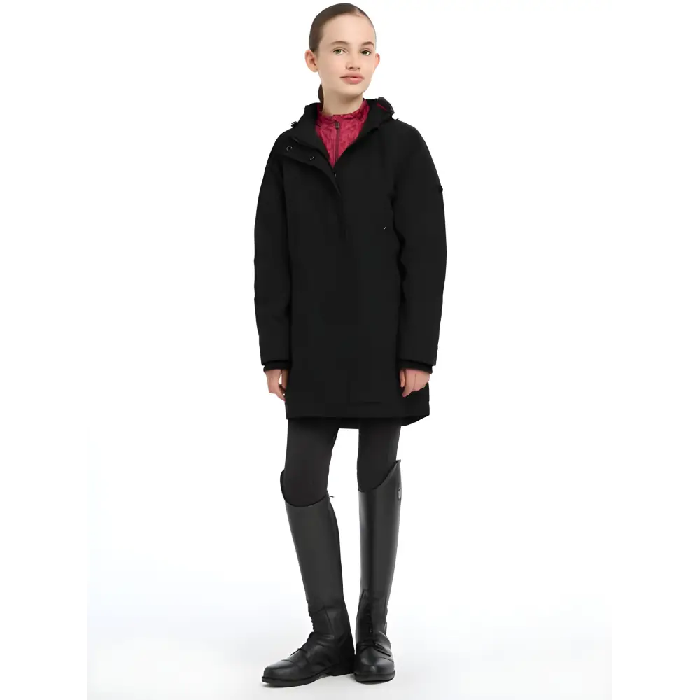 Black waterproof coat with a hood over red top, Lemieux Young Rider Skye style