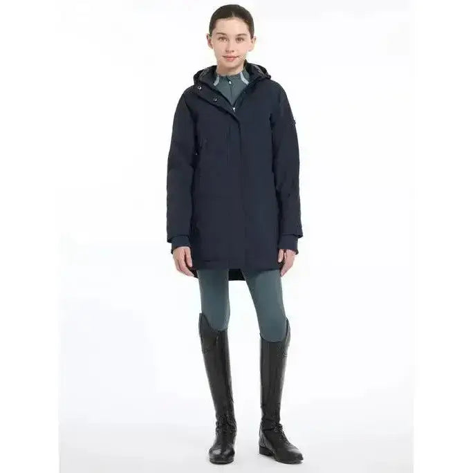 Dark navy lemieux young rider skye waterproof coat with sleek design and subtle sleeve branding perfect for winter rides