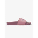 A dusty rose lemieux young rider slide sandal with minimalist design and embossed branding on the strap