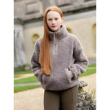 A cozy ash gray lemieux young rider tia teddy fleece jacket with high collar and half-zip front