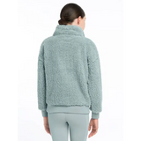 Fluffy mint-green Tia Teddy fleece jacket with high collar, back view of Glacier style