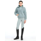 Light blue tia teddy fleece hoodie with hood and zipper paired with matching leggings from lemieux young rider collection