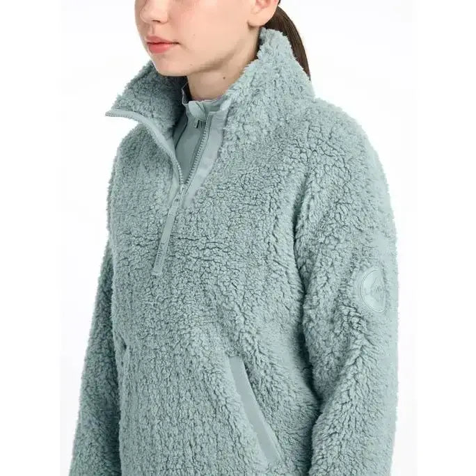 A soft light blue tia teddy fleece jacket with high collar and zipper from lemieux young rider collection