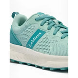 A mint green lemieux youth trainer aqua with breathable mesh upper teal laces and a white midsole for equestrian use